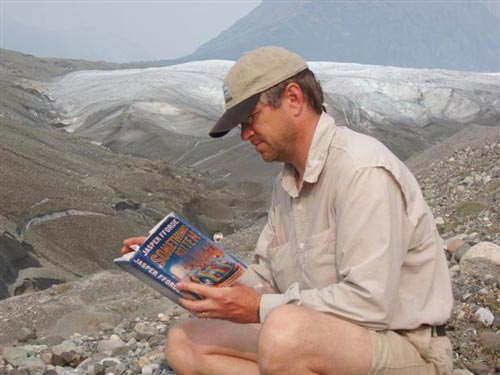 Joe Roth reads Something Rotten during a rafting trip in Alaska .